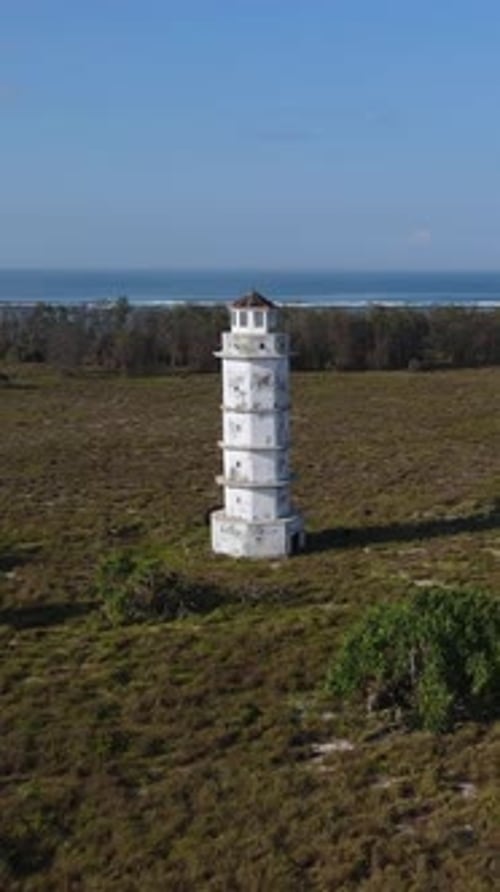 Aerial View of Old Lighthouse at Ocean Coastline