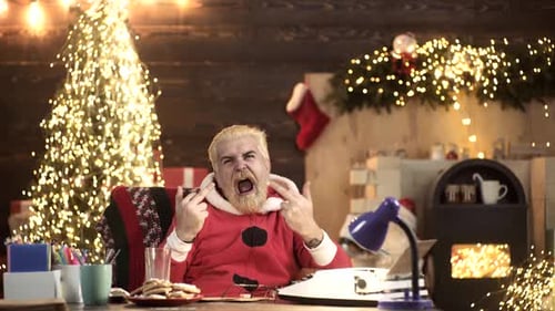 Man in Jumpsuit Making Gestures at Desk
