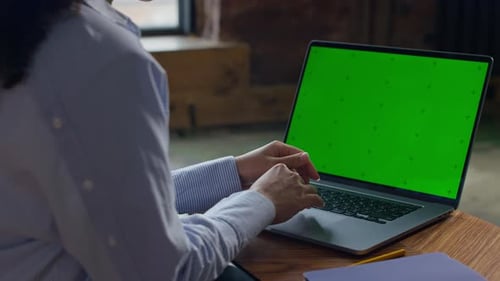 Hands Using Laptop with Green Screen Mockup