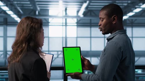 Server Room Data Scientists Using Mockup Tablet Conducting Security Audits