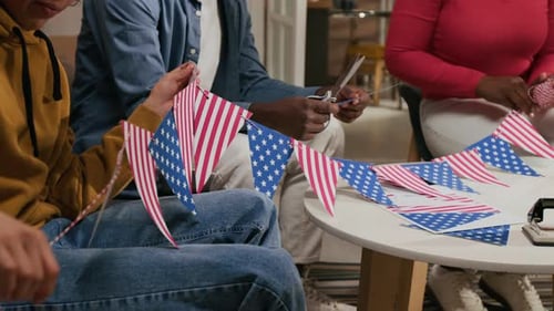 Family Making Patriotic Decorations at Home