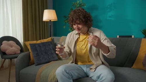 Man Drinks Water, Experiences Choking Sensation on Couch