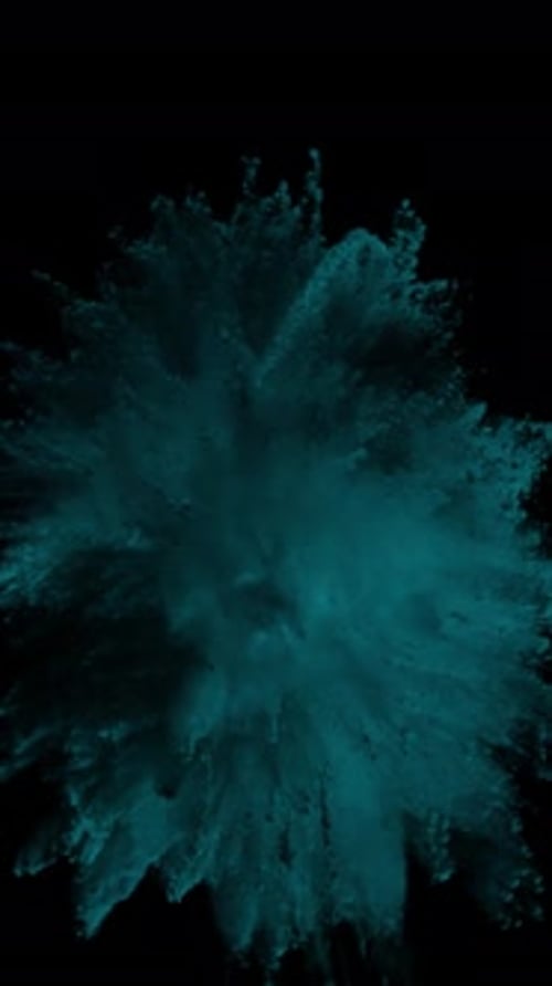 Abstract Teal Particle Explosion on Black Background