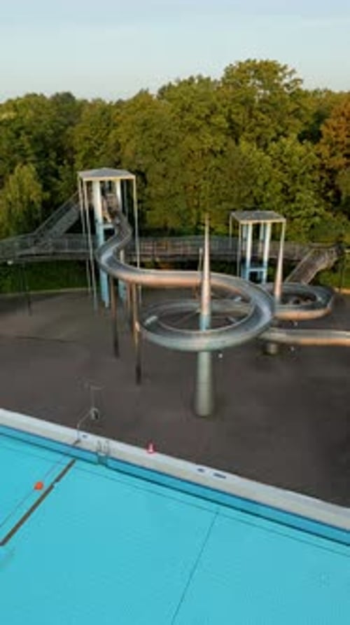 Aerial view of pools and waterslide in greenery, Germany.