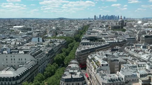 Printemps Haussmann luxury mall and cityscape, Paris. Aerial backward