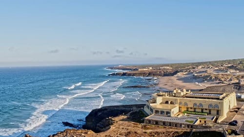 Aerial Drone View of Waves Breaking onto Sandy Beach Shore