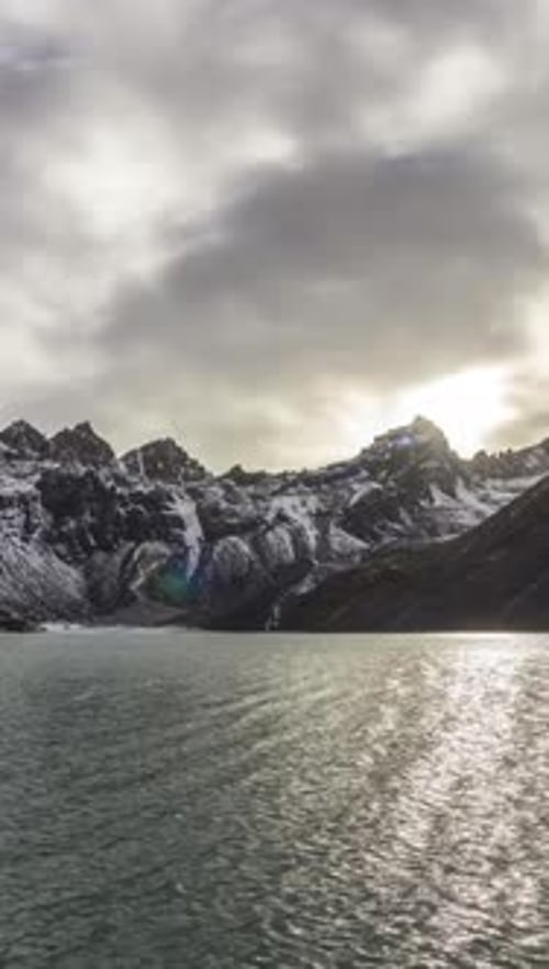 Gokyo Lake and Snowy Mountains Dramatic Sky and Rolling Sun Himalaya Nepal Vertical Video