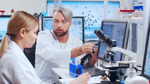 Scientists Collaborating on Medical Research in Laboratory