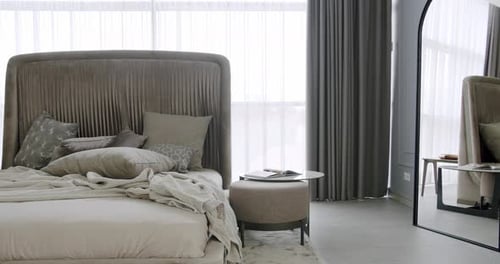 Modern Hotel Bedroom Interior and Bed with Many Pillows Neoclassical Interior