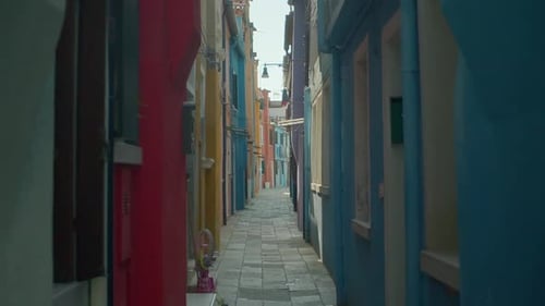 Walking Between Unique Colored Buildings In Burano Island, Venice, Italy