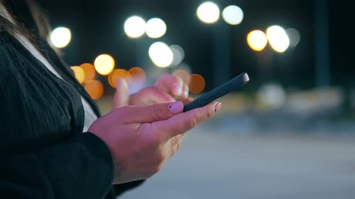 Adult Using Mobile Phone at Night, Close Up