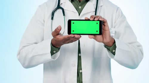 Doctor, hands and green screen of phone in studio for advertising healthcare choice
