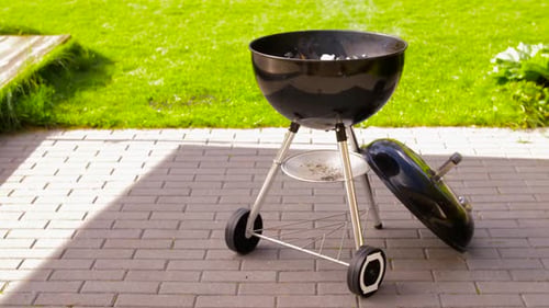 Charcoal burning brightly in brazier outdoors a summer barbecue concept