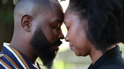 Loving Couple Touching Foreheads at Sunset