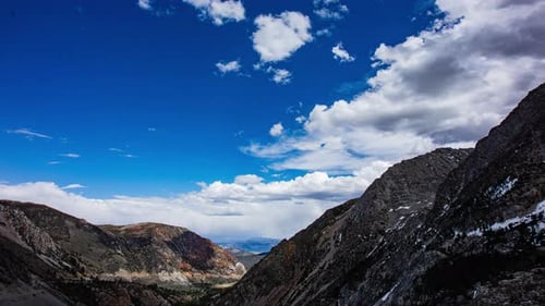 Time Lapse - Beautiful cloudscape moving over mountain rage and the valley