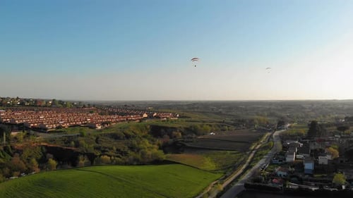 paragliding flying over the mountains