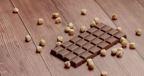 Chocolate Bar With Hazelnuts On Wooden Surface Sweet Dessert Nuts