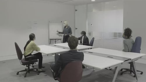 Business Meeting with Presentation in Modern Office