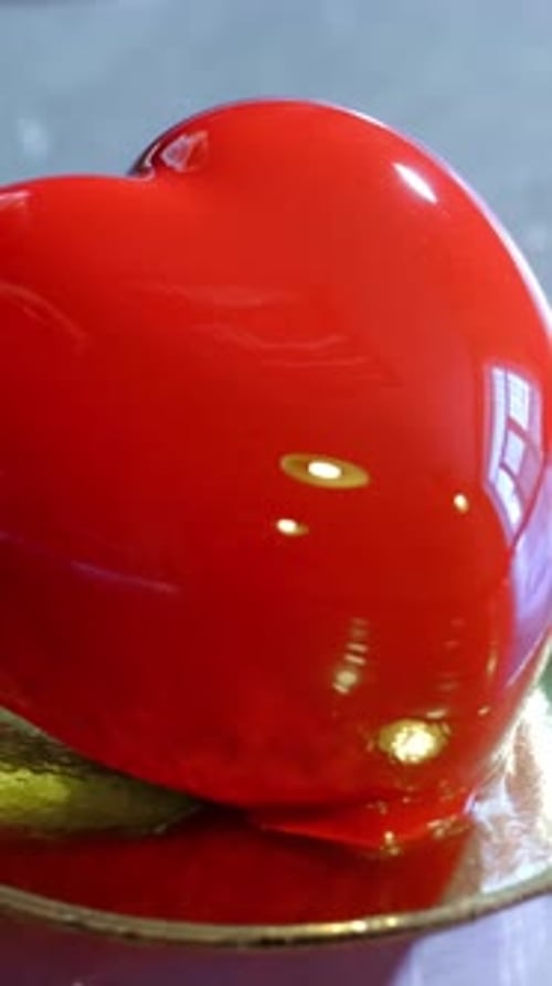 Shiny Red Heart Cake in Studio Setting