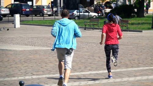 Active Couple Jogging In The City, Super Slow Motion