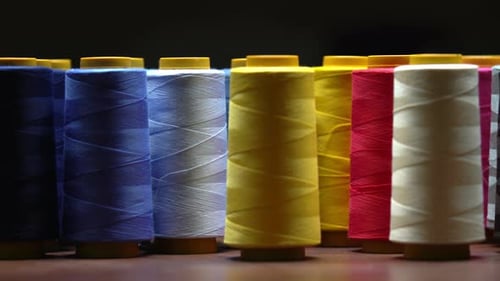 Shot Of Colourful Cotton Thread Spools Inside A Clothing Manufacturing Sweatshop