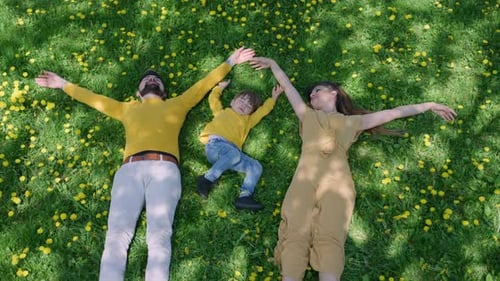A family enjoying a blissful picnic on green grass under the sun