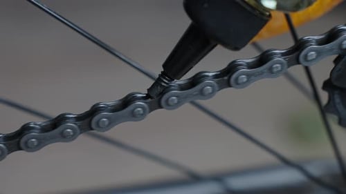 Bicycle Transmission Chain Lubrication Process Close Up