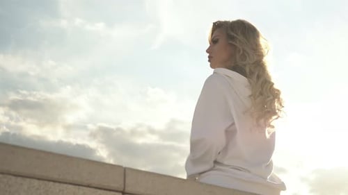 Stylish Woman with Blonde Hair Posing in City
