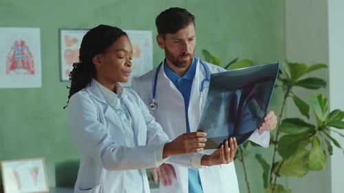 Professional Team of Multiethnic Doctors Cooperating in Medic Healthcare Clinic Male and Female