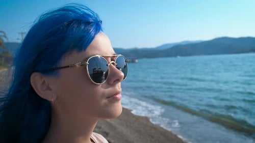 A Girl with Blue Hair Looks at the Sea
