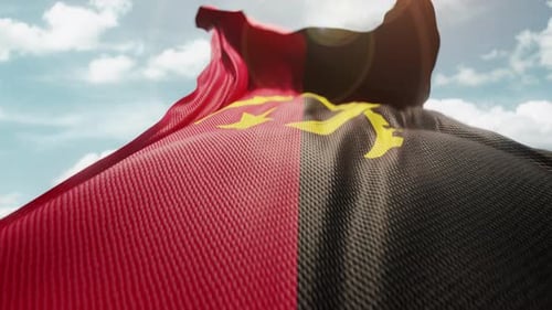 Angola Flag Waving in Realistic Slow Motion with Blue Sky