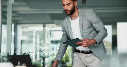 Man, tablet and reading in office for business, schedule update and company news on website