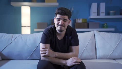 Emotional young man thinks about good memories.