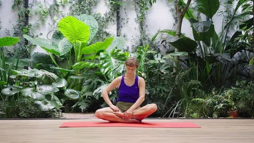 Woman in focused inversion in modern studio