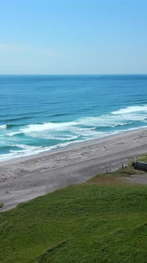 Panoramic Aerial Shot of a Sunny Coastal Landscape in Spain Clip Green Meadow Highlands and Sea