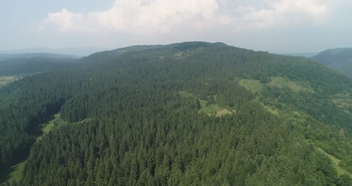 Aerial Cinematic Clip Drone Flying Over a Beautiful Summer Landscape of Endless Meadows and Hills