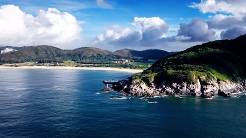 Aerial Top view of a transparent blue sea with beautiful waves at sunny day in summer. air of ocean