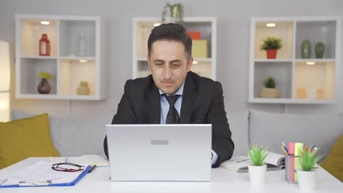 Ambitious and determined portrait of home office worker man.