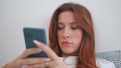 Woman Using Cellphone And Typing - Close Up