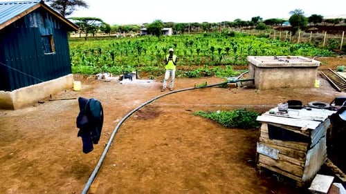 Rural agricultural farms in Kenya. Drone pilot land survey. Smart Agriculture technology.