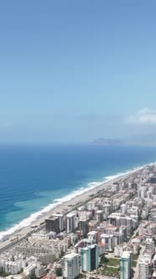 Vertical Video Seaside Bliss Aerial Footage of a Tranquil Coastal Community