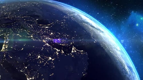 Seamless video loop, a view from space of planet Earth with glowing city lights.