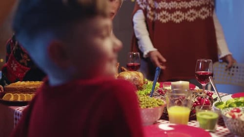 Family Celebrates with Festive Holiday Dinner at Home