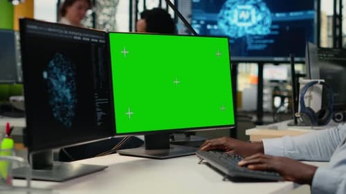 Green Screen PC Used By Technician in Office Using AI to Optimize Systems
