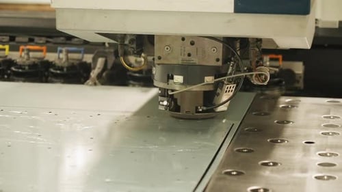Close up of a CNC punching processing sheet metal, China