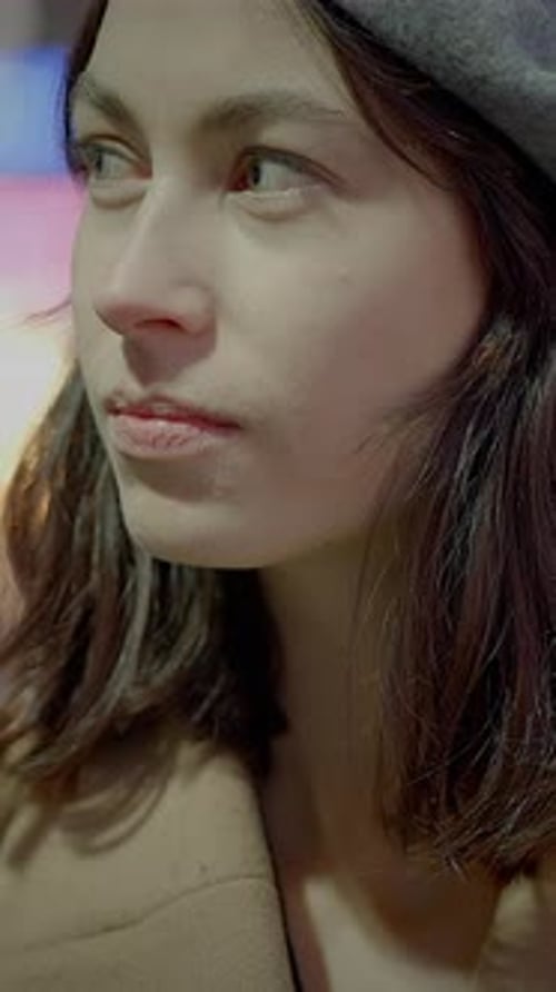 Stylish Woman Smiles Brightly in Close-Up Portrait