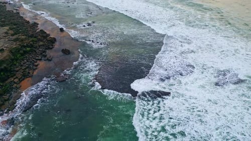 Foggy Sea Covering Beach Drone View Rippling Waves Washing Volcanic Pebbles