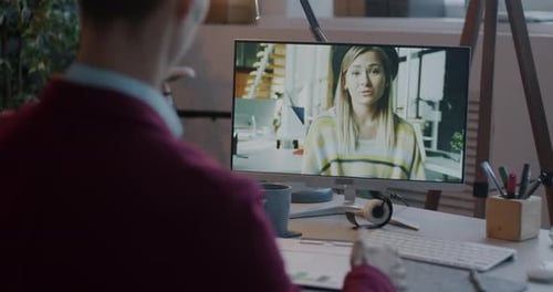 Two Businesspeople Discussing Work Talking and Gesturing at Virtual Meeting Making Online Video Call