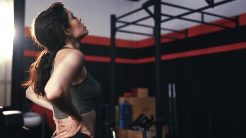 Woman Stretching Back at the Gym