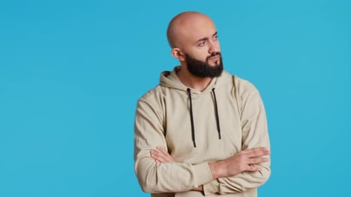 Man Posing with Arms Crossed in Studio